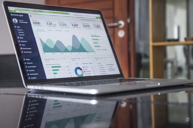 Business website planning and analytics on a laptop